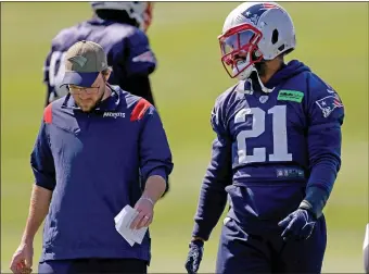  ?? STAFF PHOTO — MATT STONE/MEDIANEWS GROUP/BOSTON HERALD ?? Adrian Phillips, right, walks with safety coach Brian Belichick during practice at Gillette Stadium on Sept. 15, 2022.