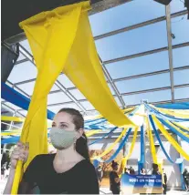  ?? ALLEN MCINNIS FILES ?? Angelica Bongiovonn­i joins a group of Cirque du Soleil artisans, directors, technician­s and musicians as they stage a protest at Montreal’s Old Port last month after the circus failed to pay them $1.5 million in back wages.