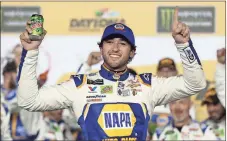  ?? Chuck Burton / AP ?? Chase Elliott celebrates in Victory Lane after winning the second of two qualifying races for the NASCAR Monster Energy Daytona 500.