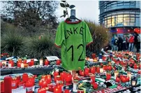  ??  ?? Outpouring of emotion: Robert Enke’s death shattered the football world and was front-page news across the globe