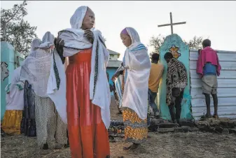  ?? Nariman El- Mofty / Associated Press ?? Ethiopians who fled fighting in the Tigray region attend church services near the Umm Rakouba refugee camp in eastern Sudan. About 44,000 people have sought shelter in Sudan.