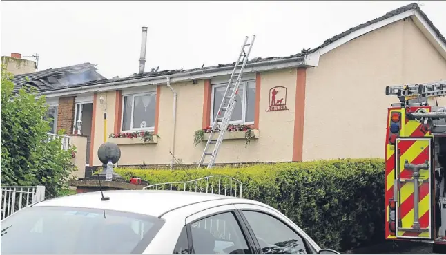  ?? Picture: David Wardle. ?? Emergency services at Mr and Mrs Hall’s house in Kennoway after it was struck by lightning.