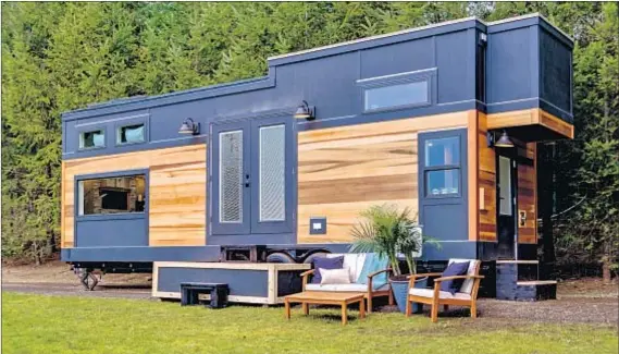  ?? Photograph­s courtesy of DIY Network ?? A LOFT EXTENSION is part of this home, featured in “Tiny Luxury,” for a Washington nature enthusiast who wanted to downsize.