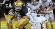  ?? PETE BANNAN — DIGITAL FIRST MEDIA ?? West Chester Rustin’s Collin Hurley (2) tries to avoid the tackle of Henderson defender Joe Saulino Thursday evening. Hurley had a 90-yard kickoff return in the game, which the Knights won 37-6.