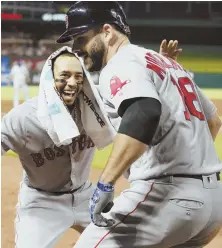  ?? AP PHOTO ?? WELCOME HOME: Mookie Betts helps Mitch Moreland celebrate his sixth-inning home run last night.