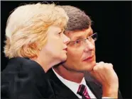  ?? Canadian Press ?? RIM chair Barbara Stymiest and CEO Thorsten Heins talk at the company’s annual meeting Waterloo, Ont., on Tuesday.