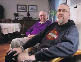  ??  ?? Peter Dawe, 50, with father Frederick, 82, at home in Powell River. Both say being kept in hospital against his will 30 years ago for treatment saved Peter’s life.