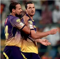  ?? AP ?? KKR’s Nathan Coulter-Nile gets a pat on his back from Yusuf Pathan after dismissing sunrisers Hyderabad’s Chris Jordan. —