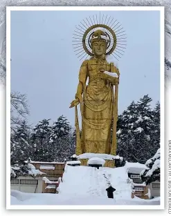  ?? ?? A golden statue glows in the snowy Japanese landscape.