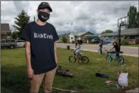  ?? The Associated Press ?? TWO AND TWO: In this photo taken June 16, Artie Mendoza III, 25, also known as KiidTruth, looks on outside his home in Pablo, Montana. Mendoza created a viral TIk Tok dance and song to promote hand washing, mask wearing and social distancing among the youth on the Flathead Indian Reservatio­n. Mendoza’s children inspired him to create the dance. “And so I put two and two together, I am aiming for our youth, why not make a fun dance too.” he said.