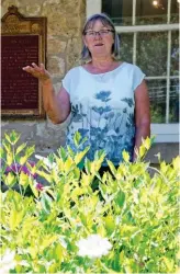  ??  ?? LEFT: A striking stone entrancewa­y leads into the John McCrae memorial gardens, adjacent to McCrae House. ABOVE: Harriet Hull is one of the volunteers who tend to the gardens that surround McCrae House.