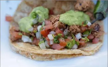  ?? Emily Matthews/Post-Gazette ?? A chicken taco dressed with salsa fresca at Las Palmas in Brookline.