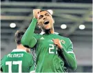  ??  ?? Late show: Josh Magennis celebrates his 87th-minute winner against Belarus