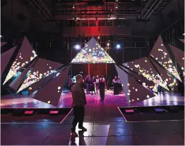  ?? (Dan Watson for the Signal) ?? Attendees walk through the exhibit entitled “Feather” at the 2018 CalArts Expo held at CalArts in Valencia on Thursday.