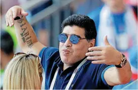  ?? [AP PHOTO] ?? Argentinia­n soccer legend Diego Armando Maradona waves to visitors during the round of 16 match between France and Argentina on Saturday in Kazan, Russia.