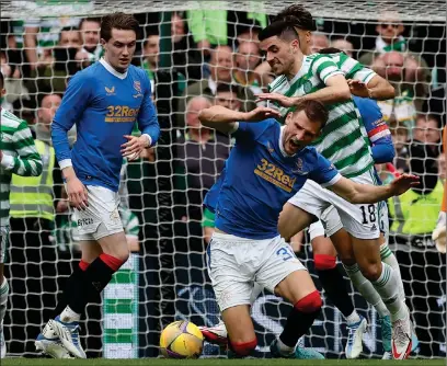  ?? ?? Tom Rogic brings down Rangers defender Borna Barisic during the stalemate at Parkhead