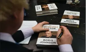  ?? ?? Boris Johnson signing copies of his biography of Winston Churchill in 2014, when Mr Johnson was Mayor of London