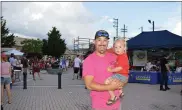  ?? RACHEL RAVINA - MEDIANEWS GROUP ?? Sam and Bodhi Clemmer, of Lansdale, pose for a photo Friday evening during Lansdale’s First Friday.