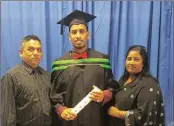  ??  ?? Engineerin­g graduate, Marco Naidoo with his proud parents, Gujen and Rita, at his graduation ceremony.