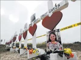  ?? David J. Phillip ?? The Associated Press Crosses showing victims names outside the First Baptist Church in Sutherland Springs, Texas. Pastor Frank Pomeroy says the church where a man opened fire Sunday, killing more than two dozen, will be demolished.