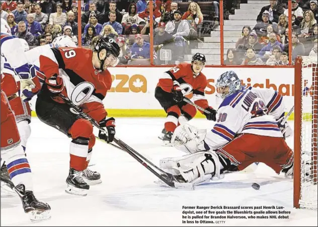  ?? GETTY ?? Former Ranger Derick Brassard scores past Henrik Lundqvist, one of five goals the Blueshirts goalie allows before he is pulled for Brandon Halverson, who makes NHL debut in loss to Ottawa.