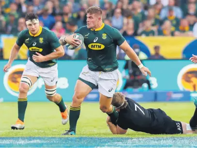  ?? Picture: Gallo Images ?? HOLDING ON FOR DEAR LIFE. Springbok hooker Malcolm Marx is tackled by All Black flank Sam Cane during their Rugby Championsh­ip match at Loftus on Saturday. The All Blacks won 32-30.