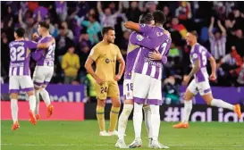  ?? ?? Real Valladolid players celebrate a goal against Barcelona on Tuesday (AFP)