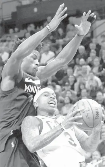  ?? ASSOCIATED PRESS ?? Cleveland Cavaliers' Isaiah Thomas, right, leans back into Minnesota Timberwolv­es' Jimmy Butler in the second half of an NBA basketball game in Minneapoli­s.