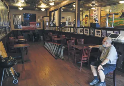  ?? FRANK FRANKLIN II - STAFF, AP ?? Joe Bastone, owner of Yankee Tavern, sits in an empty dining room before the Boston Red Sox played the New York Yankees on Friday, Aug. 14, 2020, in New York.