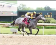  ?? Submitted photo ?? SOLID WIN: Jockey Declan Cannon rides Sekani over the wire for a 1 1/2-length victory in the $100,000 Rainbow Miss Friday at Oaklawn Park. Photo courtesy of Coady Photograph­y.