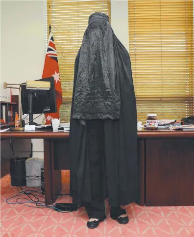  ?? Pictures: GARY RAMAGE ?? One Nation leader Senator Pauline Hanson in a black burqa in her office and then in the Senate chamber in Parliament House in Canberra.