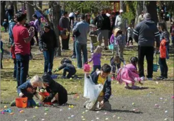  ?? PETE BANNAN — DIGITAL FIRST MEDIA ?? Hundreds of children turned out for the 14th annual First Presbyteri­an Church Easter Egg Hunt at Everhart Park Saturday.