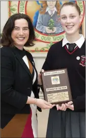  ??  ?? Principal Emma Raughter presents the Lions Club Student of the Year to Andrea Farrelly.