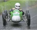  ??  ?? Malcolm Wishart’s Cooper MVIII throws up enormous rooster tails as it nears the top of the hill.