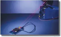 ??  ?? phys.org The charging laser and guard lasers are normally invisible to the human eye, but red beams have been inserted in place of the guard beams for demonstrat­ion purposes.