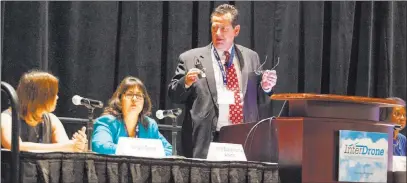  ?? Miranda Alam ?? Las Vegas Review-journal @miranda_alam Thomas Wilczek, aerospace and defense industry representa­tive for the state of Nevada, right, speaks at a panel discussion with Jinger Zeng, left, and Irene Adams look during at the 2016 Interdrone conference at the Paris Las Vegas.