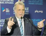  ?? RYAN REMIORZ/ THE CANADIAN PRESS ?? “For the changes we need, which are not marginal, we need a majority government,” says Liberal Leader Philippe Couillard.