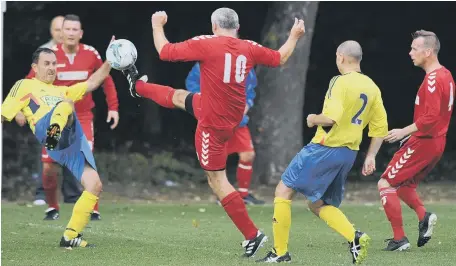  ??  ?? Ryhope Foresters (yellow) battle to victory against Wearmouth CW in the Over-40s League last weekend.