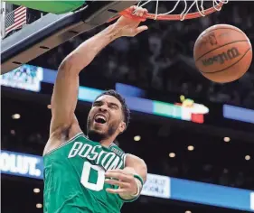  ?? AP ?? Celtics guard/forward Jayson Tatum dunks against the Nets during Game 2 of a first-round playoff series on April 20 in Boston. The Celtics and the Bucks square off on the conference semifinals.