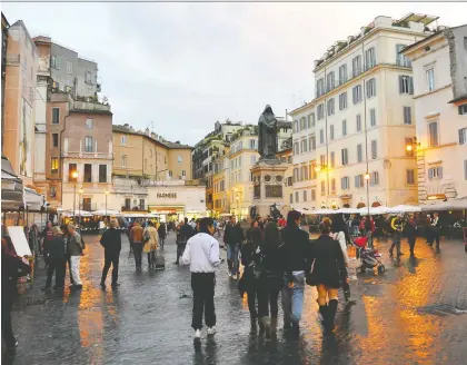  ?? CAMERON HEWITT ?? A statue of Giordano Bruno stands on the spot where he was burned to death in the centre of Rome's Campo de' Fiori for challengin­g the church five centuries ago.