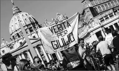  ??  ?? Protesters hold a ‘Truth for Giulio’banner in front of St Peter’s Basilica in Rome in 2016. The student’s body was found outside Cairo in January 2016. (Photo:EPA)