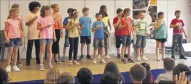  ??  ?? Les élèves de l’école Brusquet sont montés sur scène pour un concert de chant et de percussion­s corporelle­s.