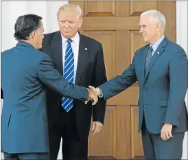  ?? Picture: AFP ?? ENEMIES NO MORE: US president-elect Donald Trump, centre, and vice-president-elect Mike Pennce, right, welcome Mitt Romney to a meeting at the Trump National Golf Club in Bedminster, New Jersey. Romney contested the Republican primaries against Trump...