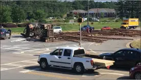  ?? Michelle Beckman / Contribute­d by ?? A truck lost a load of logs in front of the Walmart in Cedartown on June 19.