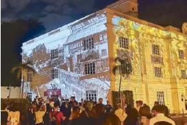  ?? Photo by JOSE PAOLO DELA CRUZ ?? Images depicting Intramuros in its heyday are projected at the United Philippine Lines Building in Fort Santiago.