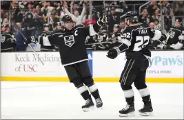  ?? RYAN SUN – THE ASSOCIATED PRESS ?? Kings left wing Kevin Fiala, right, celebrates his goal with center Anze Kopitar during the second period of Saturday night’s game against the Canucks at Crypto.com Arena.