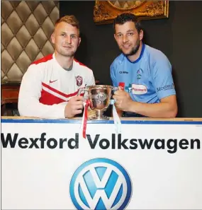  ??  ?? Moyne Rangers captain Rory O’Connor and North End United captain Jason Murphy at the reception in Treacy’s Hotel.