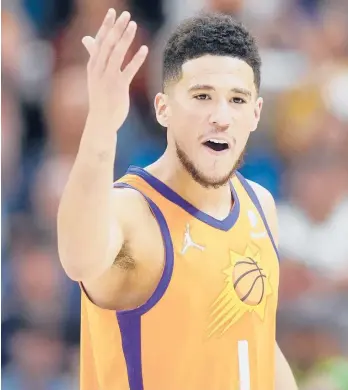  ?? RICK BOWMER/AP ?? Suns guard Devin Booker argues with an official during Friday’s game against the Jazz in Salt Lake City.