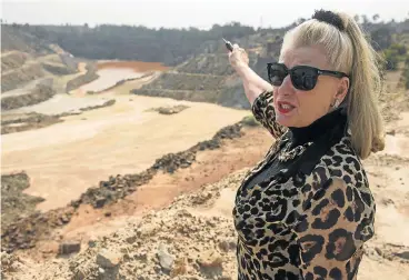  ?? /Photo: Waldo Swiegers/Sunday Times ?? Clean-up nightmare: Mariette Liefferink, CEO of Federation for a Sustainabl­e Environmen­t, points to dams on mine operations that damage the environmen­t.