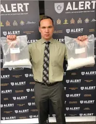  ?? SUBMITTED PHOTO ?? S-Sgt. Cory Both holds up more than a kilogram of meth seized from an arrest on Dec. 8 by ALERT as part of an investigat­ion which led to the city’s largest meth seizure ever.